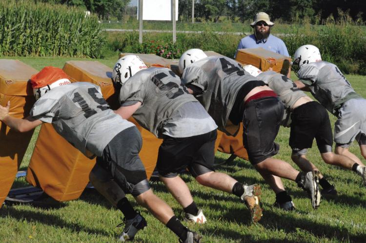 THE AGGIES hope the intensity of a recent practice at Hardin-Central, finished off with reps of pushing a blocking sled, will carry over into competitive regular-season performances in varsity 8-man football. SHAWN RONEY | Staff