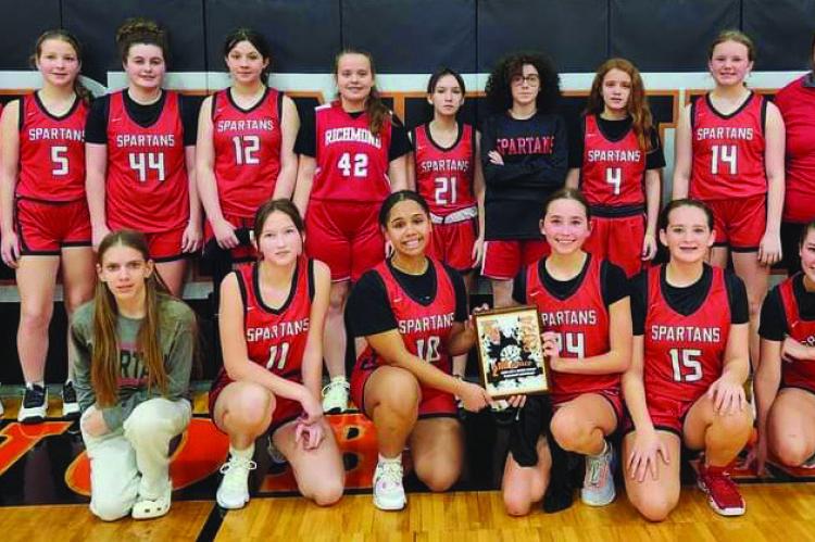 MEMBERS OF THE Richmond Middle School girls basketball program pose after receiving the second-place plaque at an end-of-season tournament at Knob Noster. From left are, front row, Ellison Rennison, Camille Green, Alana Ramos, Brylee Castilleja, Danika Richardson and Adilyn Swope; back row, assistant coach Megan Baker, Madison Shroyer, Olivia McCroskie, Izzy Hash, Zenna Barr, Kaeleigh Damron, Trinity Slater, Jadyn Schmidt, Ava Wilson and head coach Megan Blankenship. ASHLEY DRAISEY | Submitted