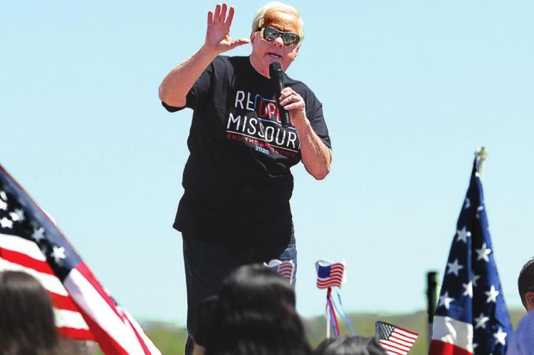 RADIO SHOW HOST Dave “Super Dave” Day warms up the Reopen Missouri crowd of about 500 on the Capitol grounds in Jefferson City last week. Several crowd members carry signs that denounce Gov. Mike Parson for issuing a stay-home order. Parson orders most of Missouri to reopen Monday. J.C. VENTIMIGLIA | Staff
