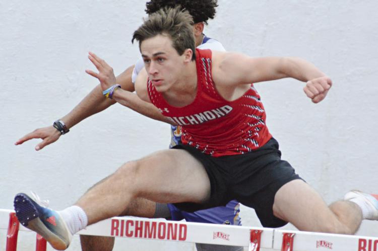 ON A QUEST to qualify for state competition again, senior Dayne Loftin zips through the boys 110-meter high hurdles March 23 during Richmond’s season- and home-opening track meet. SHAWN RONEY | Staff