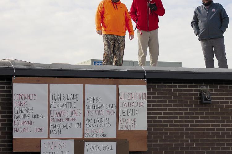 RICHMOND HIGH SCHOOL Principal Brandon Quick (from left), RHS Assistant Principal Matt Habermehl and RHS Athletic Director Josh McCray spent the night on the roof as part of SOPHIA BALES | Staff the Raise the Roof fundraiser.