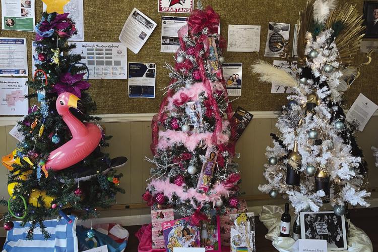 THE CITY OF Richmond (from left), Edward Jones, and the Richmond News decorated its trees for the Richmond Area Chamber of Commerce Annual Christmas Tree Raffle. SOPHIA BALES | Staff