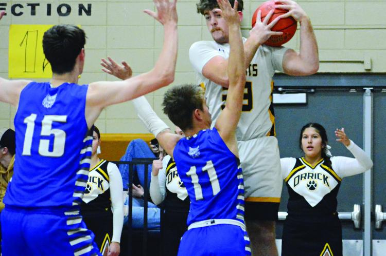 ORRICK’S TUCKER GREER appears to draw contact from Southwest of Livingston County’s William Hughes Nov. 30 at Orrick. SHAWN RONEY | Staff
