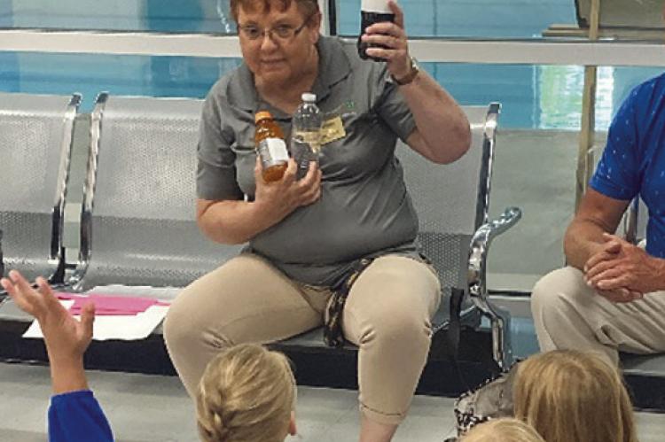 SUE ROBISON shows healthier drink options with her audience. Submitted