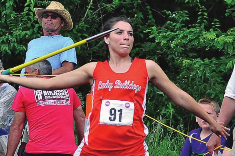 IN AN ALTERNATE WORLD, Hardin-Central senior Izabella Anderson, shown here at the 2019 Class 1 state competition, not only competes in 2020 at state; she wins the javelin and helps the Bulldogs win the meet. SHAWN RONEY | Staff