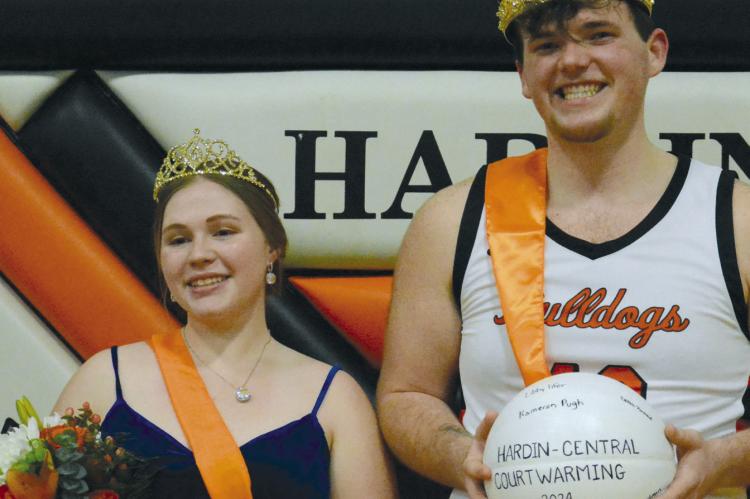 CADY MUSSELMAN (left) and Jesse Doyle savor the moment of being crowned courtwarming queen and king, Feb. 1 at Hardin-Central. SHAWN RONEY | Staff