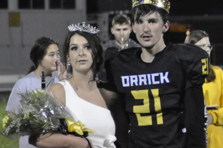 SHAWN RONEY | Staff SENIORS MAYCE MILLER, left, and Ethan Wilson bask in the glow of being crowned homecoming queen and king Sept. 11 at Orrick.