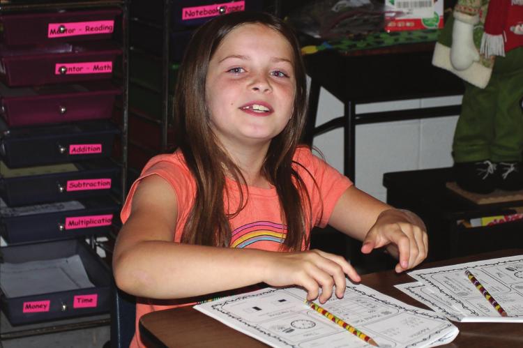 THERE ARE TRADITIONAL summer school classes in Richmond and fun classes and a mix of both as Payton Roller, 8, reacts with a smile in teacher Jamie Marrant’s math class. Find the story on Page 8. J.C. VENTIMIGLIA | Staff