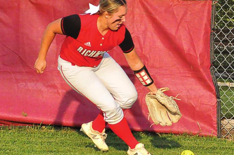 AIREANNA HOEPPER chases down a base hit to right field Monday against Excelsior Springs.