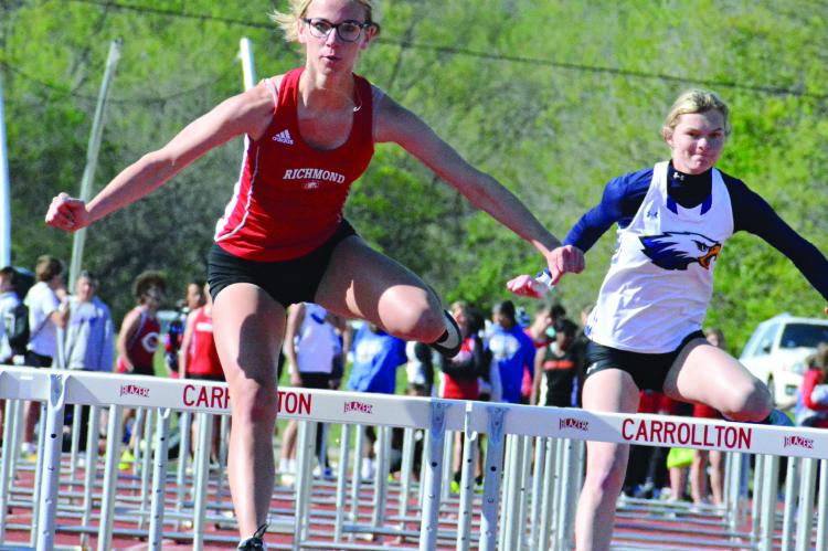 RICHMOND SOPHOMORE Kaylee King goes airborne near the end of the 110-meter high hurdles Monday afternoon at the Missouri River Valley Conference East Division varsity girls meet at Carrollton. SHAWN RONEY | Staff
