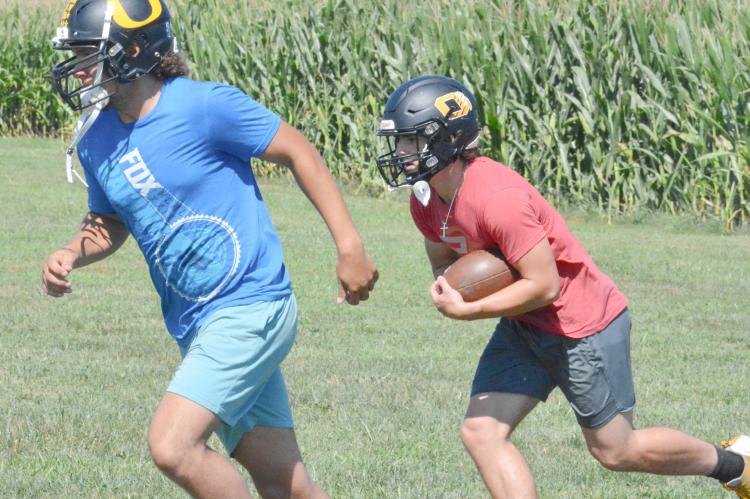 ORRICK SENIOR Milo Nay, left, leads for Jaxon MIller Aug. 9 on the Orrick practice field as the Bearcats prep for the 2022 8-man football season, slated to start Friday against St. Paul Lutheran in Concordia. SHAWN RONEY | Staff