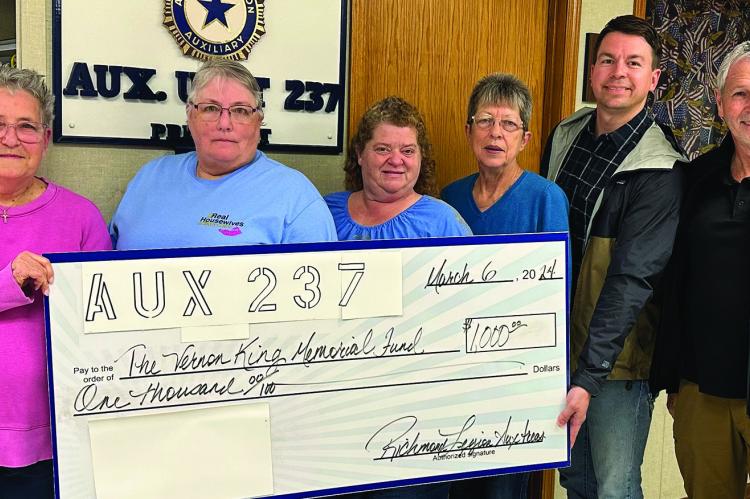 VICKEY EDWARDS (from left), Sally Foley, Rachelle Green and Brenda Richardson of Richmond Legion Auxiliary 237 award $1,000 to Chris Ring and Brad Marroitt of the Vernon King Memorial Foundation. This foundation covers transportation costs for local veterans. Read about it in the next edition of Richmond News. Submitted