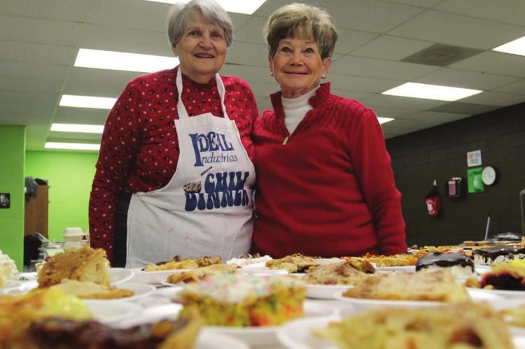 JUST DESSERTS are served by Beverly Phipps and Jean Schmidt.