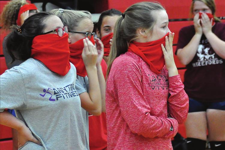 THE RICHMOND VOLLEYBALLERS adapt to sports in a COVID-19 world, donning their gaiter masks during a break between early-morning practice reps Aug. 21 at Sunrise Elementary School. SHAWN RONEY | Staff