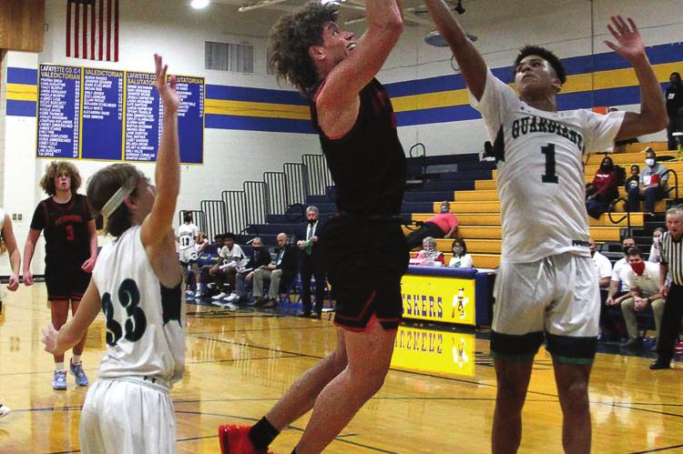 THE SPARTANS – with Keyshaun Elliott shooting against St. Michael the Archangel in early December in the Husker Classic – “are in a pretty good place” after Holden and Carrollton wins put them at 5-1, coach Kevin Jermain says. J.C. VENTIMIGLIA | Staff