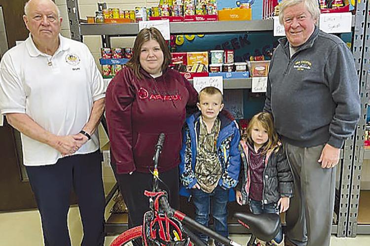 Landyn Lee (center), 6, was the recipient of a brand new bicycle from the GAP Assistance Program of Ray County’s recent raffle. Pictured with Landyn is Don Lake (from left), founder of the GAP program, Landyn’s mom, Jessica Lee, sister Christine, and GAP board member David Miller. DON LAKE | Submitted