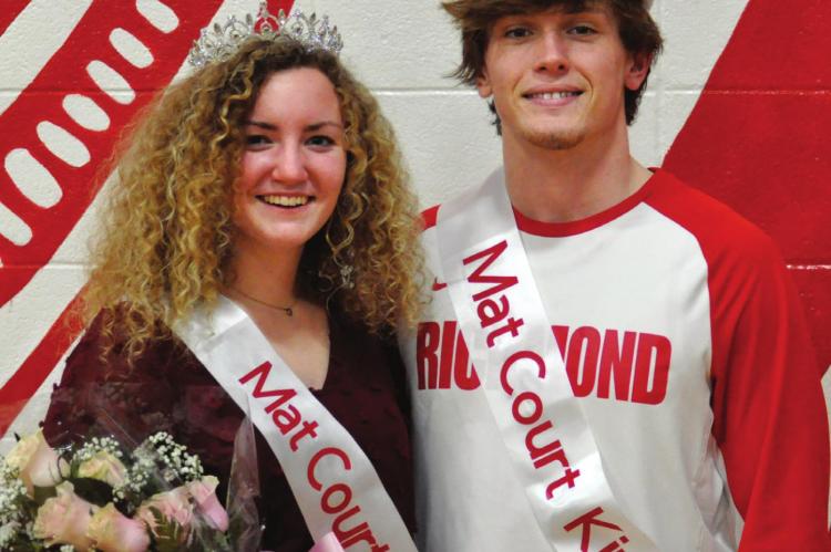 SOPHIA FARNAN and Wyatt Marshall sport their crowns and sashes for a Feb. 5 photo op after Richmond’s varsity court warming basketball games. SHAWN RONEY | Staff