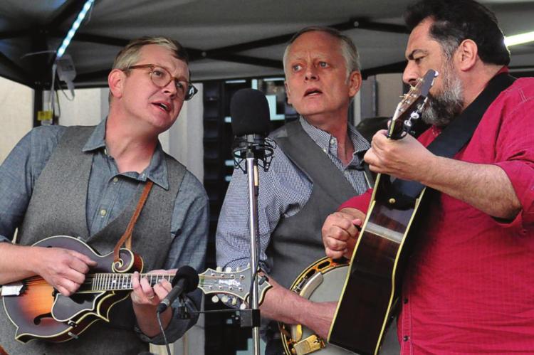 HARMONIZING, from left, are Brian McCarty; Excelsior Springs native Todd Davis; and Greg Blake. They sing tight as the Greg Blake Hometown Band performs at the Hall of Waters during Gatsby Day in Excelsior Springs. SHAWN RONEY | Staff