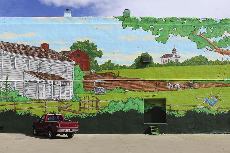 THOSE ENTERING downtown Richmond from the west will find a new mural that depicts a scene from Ray County history. The Ray County Community Arts Association pays for the mural and seeks donations. J.C. VENTIMIGLIA | Staff